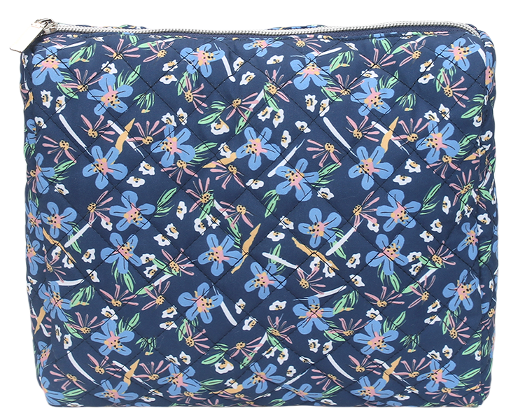 Wide opening quilted toiletry pouch with full zipper closure for travel makeup storage