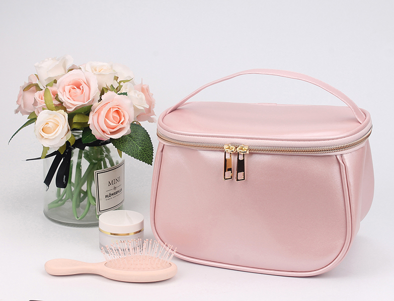 Large capacity pink satin makeup bag with top hand strap, double gold metal zippers, portable travel cosmetic organizer bag