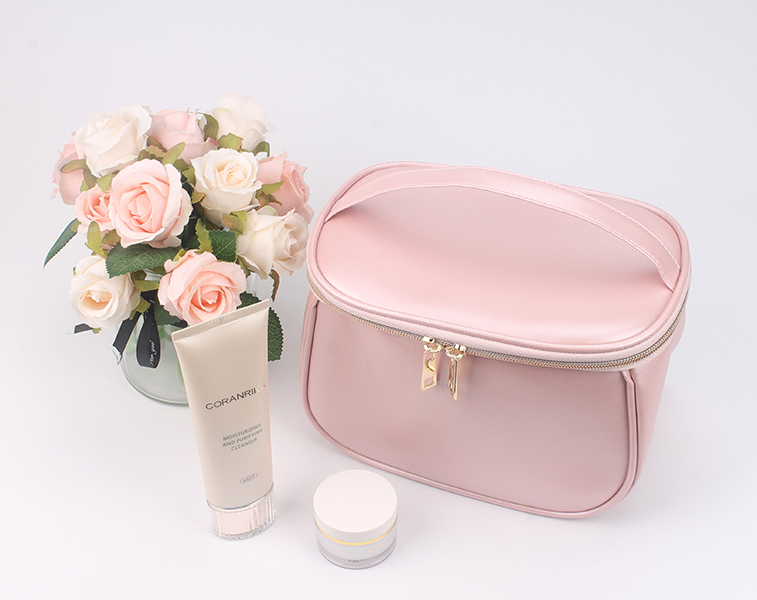 Large capacity pink satin makeup bag with top hand strap, double gold metal zippers, portable travel cosmetic organizer bag