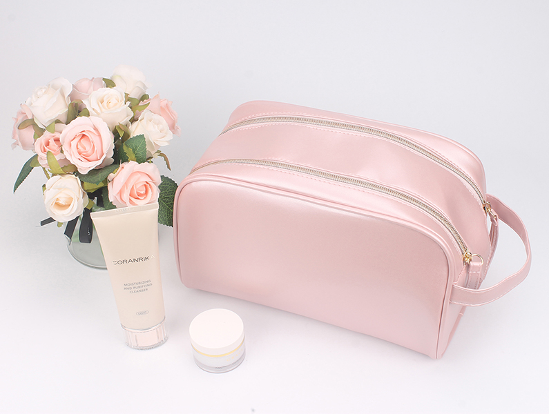 Large capacity pink satin cosmetic bag with side small hand strap, single metal zipper, portable skincare toiletry organizer bag